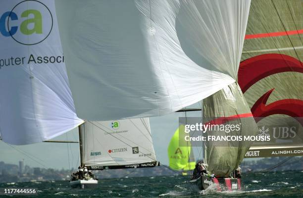 Swiss's Team Alinghi on the water off Auckland during the race against USA's Stars & stripes in Round Robin One of the Louis Vuitton Cup, 10 October...