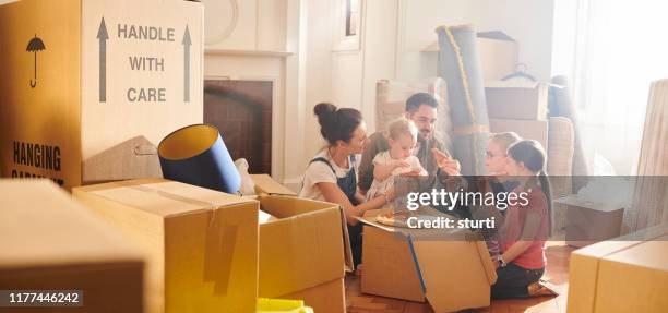 first meal  in the new house - family moving house stock pictures, royalty-free photos & images