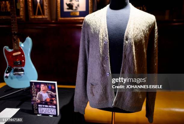 Kurt Cobain's cardigan from Nirvana's 1993 MTV Unplugged performance is on display at the Hard Rock Cafe in New York City ahead of the auction of...