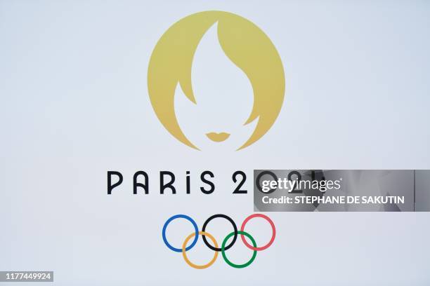 This picture taken on October 21, 2019 shows a logo during a logo presentation ceremony for Paris 2024 Olympic Games at the Grand Rex cinema in Paris.