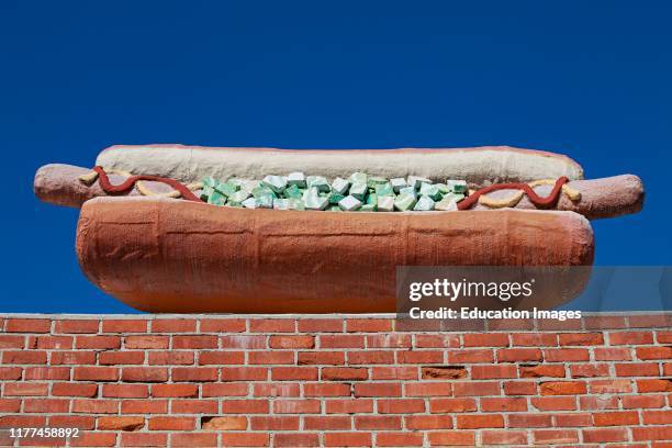 Giant Hot Dog sculpture on top of building in Culver City, Los Angeles, California, USA.