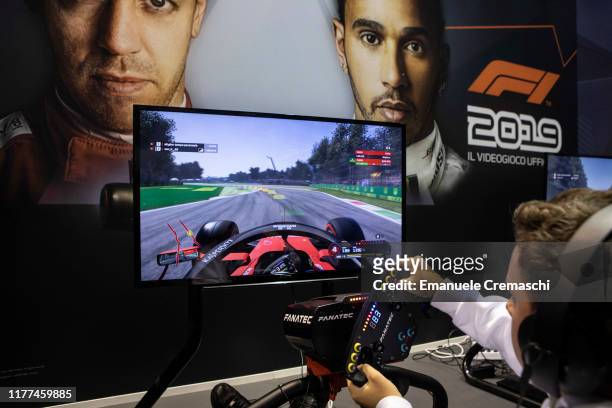 Fairgoer plays F1 2019 at the PS4 PlayStation stand during the Milan Games Week 2019, on September 27, 2019 in Milan, Italy. The Milan Games Week is...