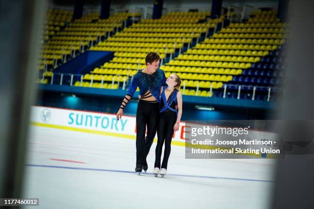 Iuliia Artemeva and Mikhail Nazarychev of Russia react after competing in the Junior Pairs Free Skating during the ISU Junior Grand Prix of Figure...