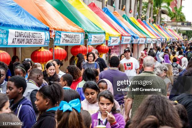 Miami-Dade College, Book Fair, people shopping at vendor booths.