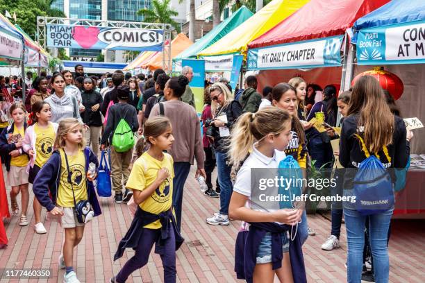 Miami-Dade College, Book Fair, people shopping at vendor booths.
