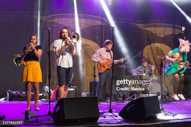 rock group playing on the concert - trombone stock pictures, royalty-free photos & images