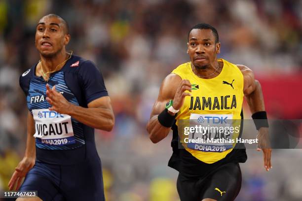 Jimmy Vicaut of France and Yohan Blake of Jamaica compete in the Men's 100 metres heats during day one of 17th IAAF World Athletics Championships...