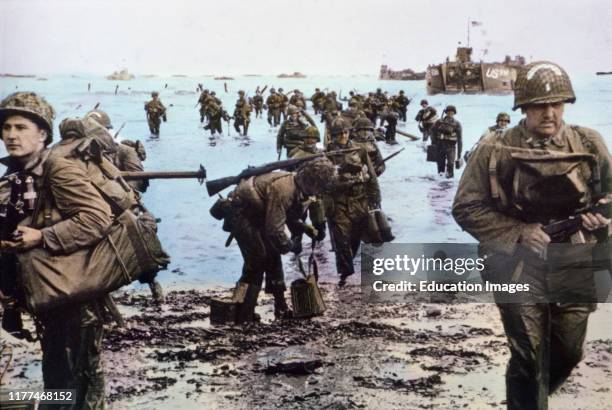 American Assault Troops with Full Equipment Move onto a Beachhead in Northern France, by Wall, U.S. Signal Corps, June 7, 1944.
