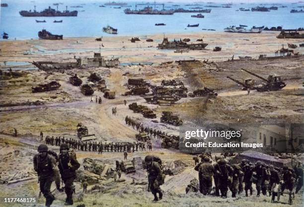 American Men and Equipment Moving in on Omaha Beach, Normandy, France, by U.S. Signal Corps, June 8, 1944.