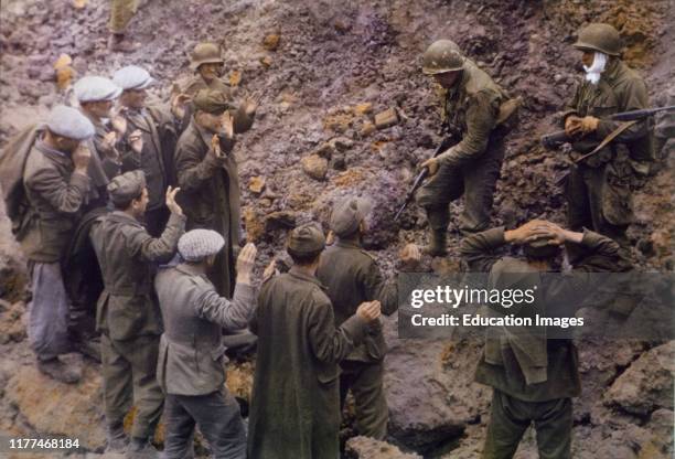 Captured German Soldiers Taken Prisoner by U.S. Troops near Pointe du Hoc, Normandy, France, June 1944.