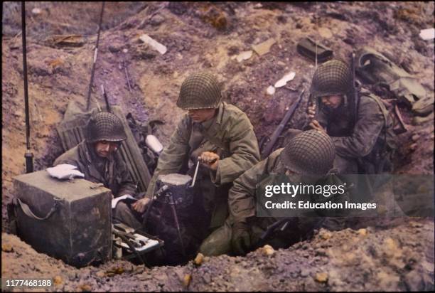 Soldiers Powering Radio Set using GN-45 Hand Crank Generator, Pointe du Hoc, Normandy, France, June 1944.