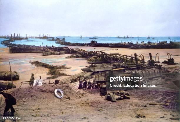 Pontoon Bridges Connecting Omaha Beach to Temporary Mulberry Harbor A, Normandy, France, June 16, 1944.