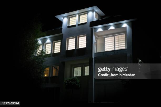 modern house at night - large grass area stock pictures, royalty-free photos & images