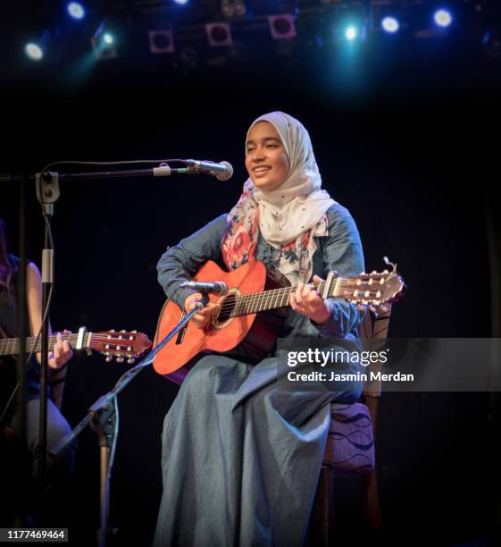 girl with guitar solo concert - guitar stage stock pictures, royalty-free photos & images