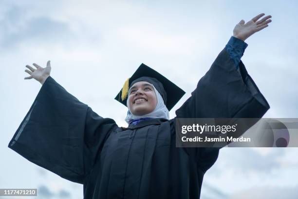 muslim girl during graduation ceremony outdoors - beautiful arabian girls stock-fotos und bilder