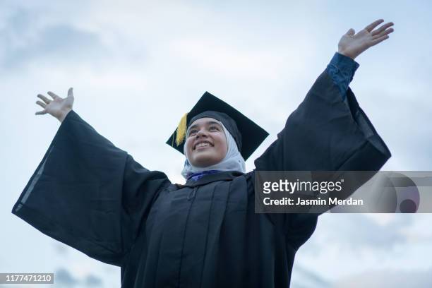 muslim girl during graduation ceremony outdoors - beautiful arabian girls stock pictures, royalty-free photos & images