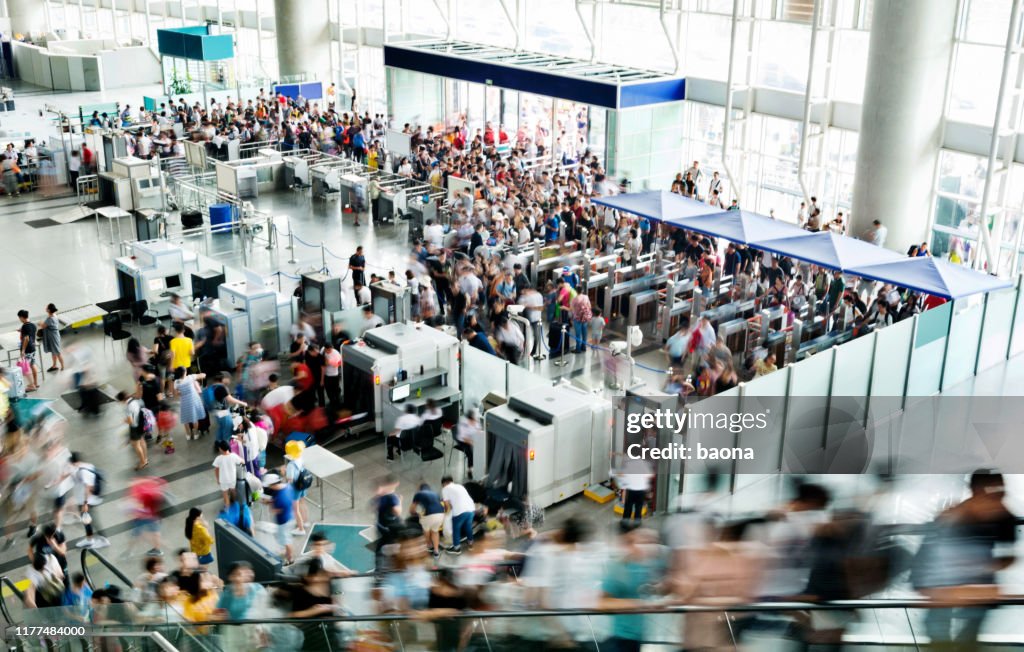 Crowd of people on railroad station lobby