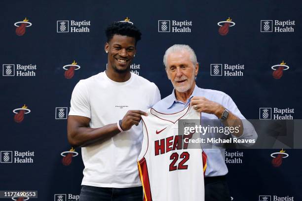 Jimmy Butler of the Miami Heat poses for a photo with president Pat Riley during his introductory press conference at American Airlines Arena on...