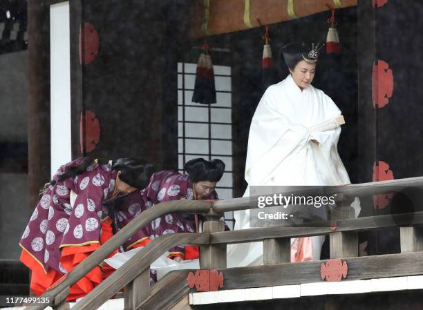 Japan's Empress Masako leaves Kashikodokoro sanctuary where Emperor Naruhito reported the proclamation of his ascension to the throne to sun goddess...