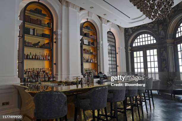 Stools surround the bar in the Writers Bar at the Raffles Hotel, operated by Accor SA, in Singapore, on Tuesday, Sept. 10, 2019. Raffles, which hosts...