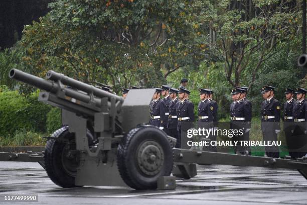 Japan Self-Defense Forces prepare to fire artilleries during the proclamation ceremony of Japan's Emperor Naruhito's ascension to the throne at a...