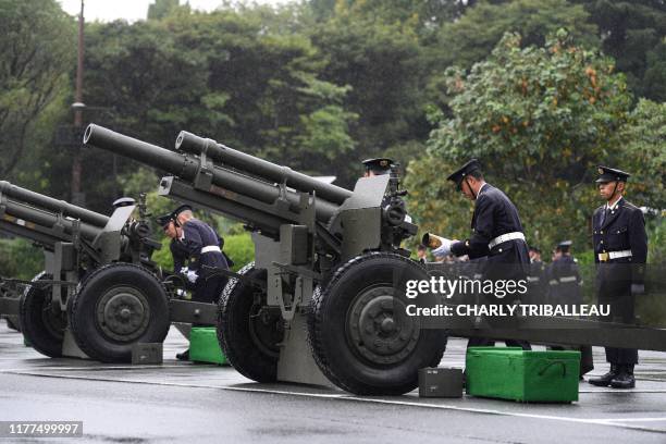 Japan Self-Defense Forces prepare to fire artilleries during the proclamation ceremony of Japan's Emperor Naruhito's ascension to the throne at a...