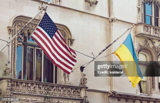 national flags of usa and ukraine in midtown manhattan - ukraine ストックフォトと画像