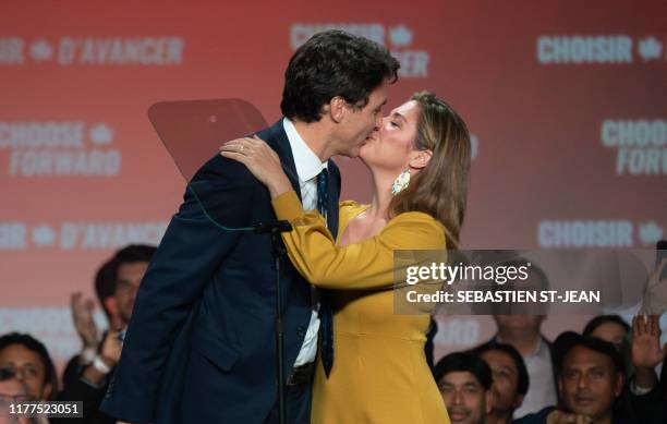 Prime minister Justin Trudeau kisses his wife Sophie Grégoire Trudeau at the Palais des Congres in Montreal during Team Justin Trudeau 2019 election...