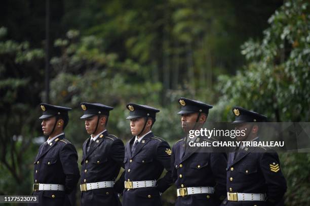 Japan Self-Defense Forces stand guard as they wait to fire artilleries to mark the proclamation of Japan's Emperor Naruhito's ascension to the...