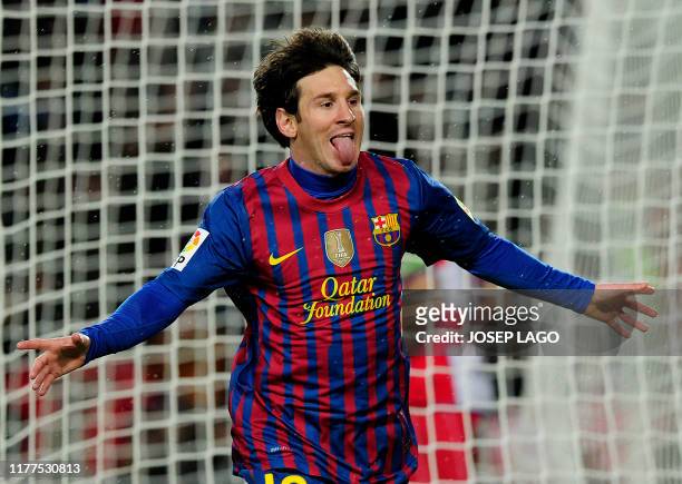 Barcelona's Argentinian forward Lionel Messi celebrates his goal during the Spanish league football match FC Barcelona vs Granada CF on March 20,...
