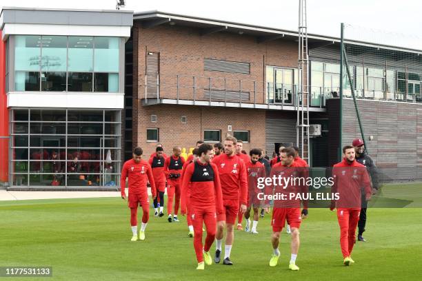 Liverpool players attend a team training session at Melwood in Liverpool, north west England on October 22 on the eve of their UEFA Champions League...