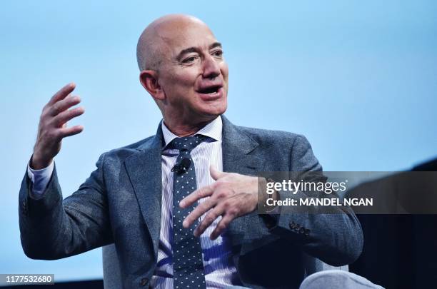 Blue Origin founder Jeff Bezos speaks after receiving the 2019 International Astronautical Federation Excellence in Industry Award during the the...