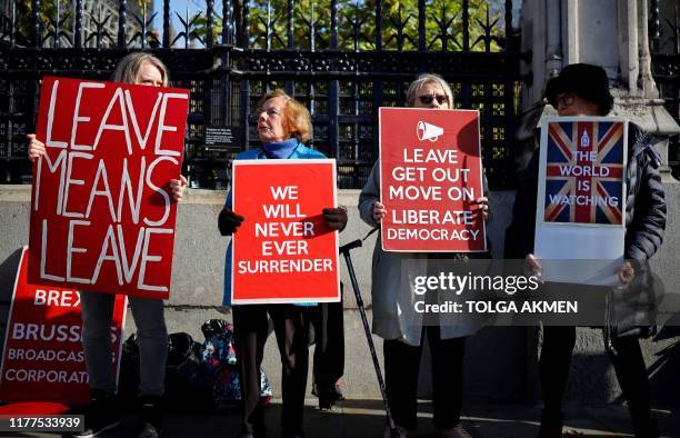 Pro-Brexit activists protest outside the Houses of Parliament in London on October 22 as MPs begin debating the second reading of the Government's...