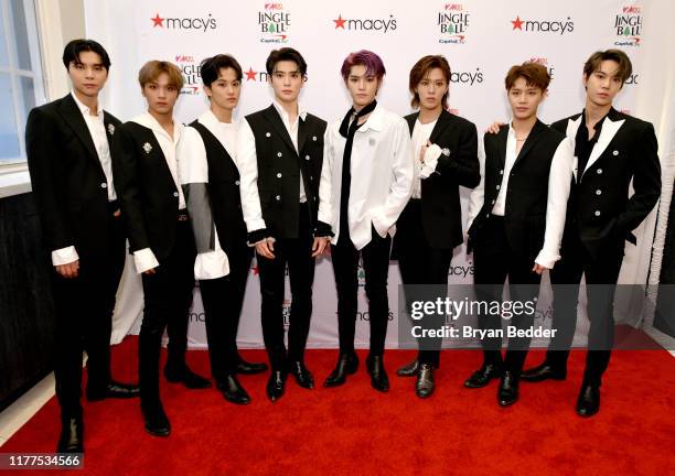 Johnny, Haechan, Mark, Jaehyun, Taeyong, Yuta, Taeil, and Doyoung of NCT 127 attend iHeartRadio's Z100 Jingle Ball 2019 presented by Capital One®...
