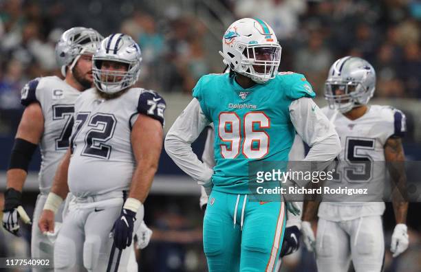Taco Charlton of the Miami Dolphins stands on the field during a game against the Dallas Cowboys at AT&T Stadium on September 22, 2019 in Arlington,...