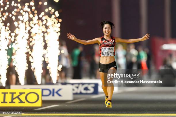 Mizuki Tanimoto of Japan celebrates as she crosses the finish line as she competes in the Women's Marathon during day one of 17th IAAF World...