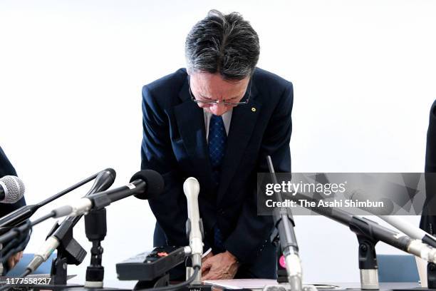 Kansai Electric Power Co President Shigeki Iwane bows for apology during a press conference on September 27, 2019 in Osaka, Japan. Kansai Electric...