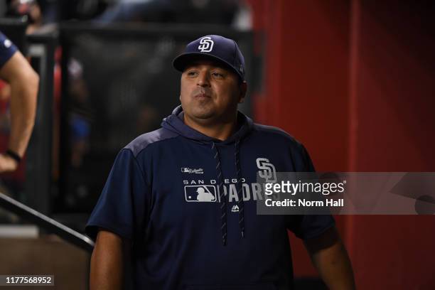 Manager Rod Barajas of the San Diego Padres walks through the dugout during the second inning of a game against the Arizona Diamondbacks at Chase...