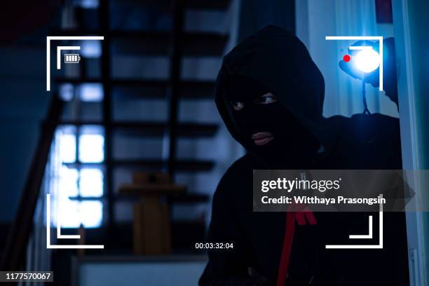 cctv view of burglar breaking in to home - security camera view stock pictures, royalty-free photos & images