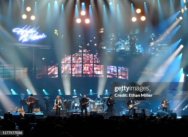 Vince Gill, Timothy B. Schmit, Don Henley, Scott F. Crago, Deacon Frey, Joe Walsh and Steuart Smith of the Eagles perform at MGM Grand Garden Arena...