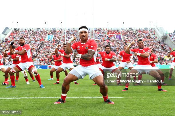 In this handout image provided by the World Rugby, Tonga players perform the Sipi Tau prior to the Rugby World Cup 2019 Group C game between...