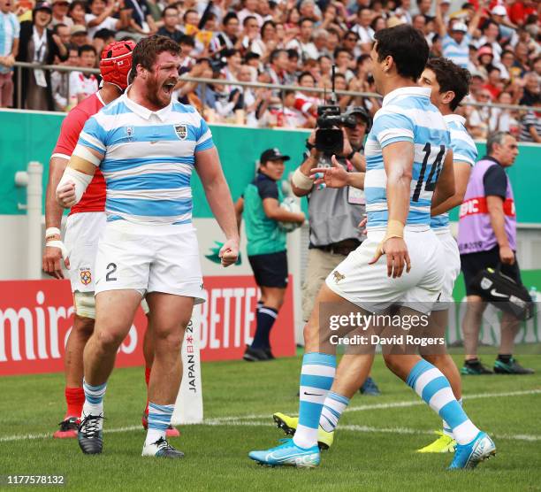 Julian Montoya of Argentina celebrates scoring his side's first try with his team mates during the Rugby World Cup 2019 Group C game between...