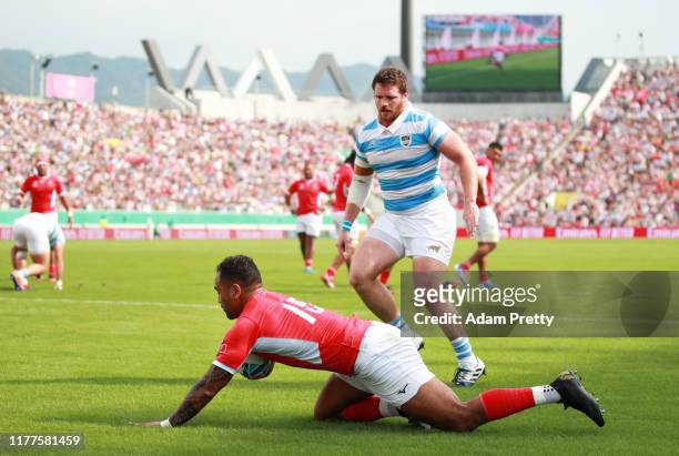 Telusa Veainu of Tonga dives to score his side's first try during the Rugby World Cup 2019 Group C game between Argentina and Tonga at Hanazono Rugby...