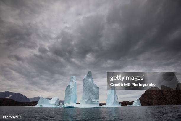 dramatic iceberg - grey clouds stock pictures, royalty-free photos & images