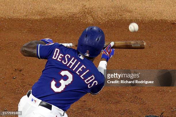 Delino DeShields of the Texas Rangers attempts a bunt in the second inning against the New York Yankees at Globe Life Park in Arlington on September...