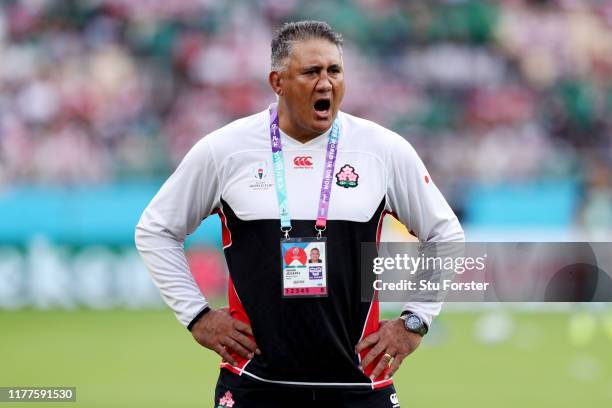 Jamie Joseph, Head Coach of Japan gives his team instructions as they warm up prior to the Rugby World Cup 2019 Group A game between Japan and...