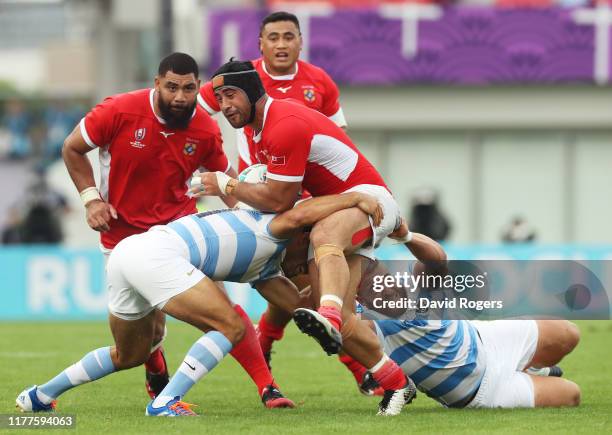 Fotu Lokotui of Tonga is tackled by Felipe Ezcurra and Mayco Vivas of Argentina during the Rugby World Cup 2019 Group C game between Argentina and...