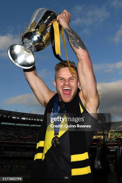 Brandon Ellis of the Tigers holds aloft the Premiership Cup after winning the 2019 AFL Grand Final match between the Richmond Tigers and the Greater...