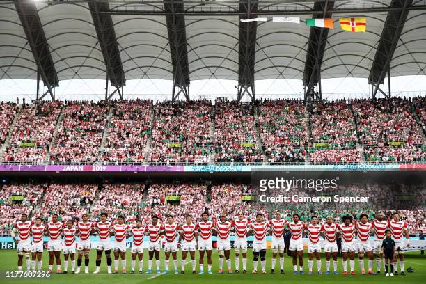 Japanese players line up for the national anthem prior to the Rugby World Cup 2019 Group A game between Japan and Ireland at Shizuoka Stadium Ecopa...