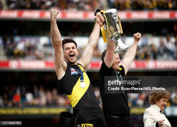 Trent Cotchin of the Tigers and Damien Hardwick, coach of the Tigers, lift the Premiership Cup during the 2019 AFL Grand Final match between the...